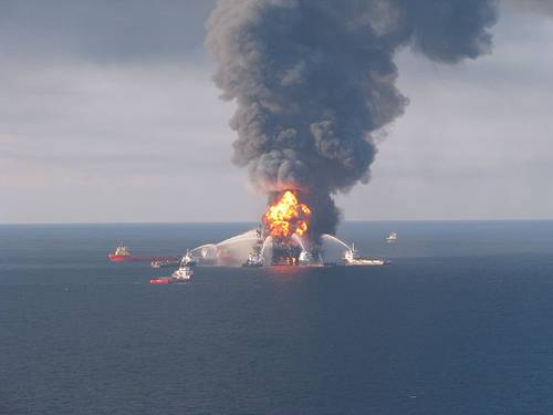Deepwater Horizon burning in April 2010. Image by US Coast Guard