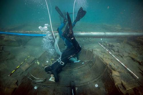 Divers from Valencia University map and assess the state of a 2,500-year-old Phoenician vessel that is submerged 60 meters from the beach of Mazarron, Spain, June 20, 2023. (Photo: Jose A Moya/Regional Government of Murcia)