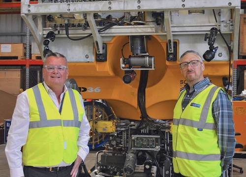 (L to R) Mr Merv New, CEO Film-Ocean and Mr Mike Mackie, Head of Operations, in the work Film-Ocean facilities in Ellon. Standing in front of a Work Class Schilling HD ROV System. Image courtesy Film-Ocean