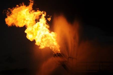 Gas from the damaged Deepwater Horizon wellhead is burned by the drillship Discoverer Enterprise in May 2010, in a process known as flaring. (U.S. Coast Guard photo by Patrick Kelley)