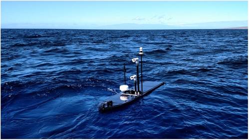 Wave Glider with BGAN dome, two cameras and additional sensors (Photo: Liquid Robotics)