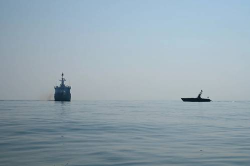 An L3 Harris Arabian Fox MAST-13 unmanned surface vessel sails behind Royal Bahrain Naval Force missile corvette RBNS Al Muharraq (P 51) during a vessel boarding drill in the Arabian Gulf during exercise Neon Defender, Jan. 22. (Photo: Anita Chebahtah / U.S. Navy)
