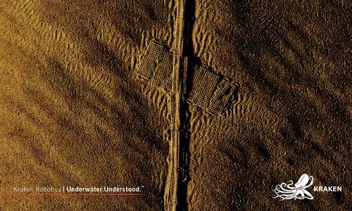 Illustrating the power of Kraken’s synthetic aperture sonars, these
images show concrete mattresses protecting a buried cable, taken from
Kraken MINSAS at 2 cm x 2 cm resolution.  The center of the mattresses
are at approximately 55 m of range, and the individual concrete blocks
are 20 cm x 20 cm. Image courtesy Kraken