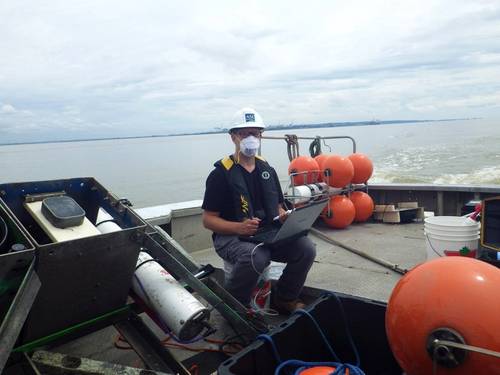 ASL’s James Bartlett examining data after instrument recovery.