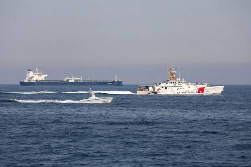 An L3Harris Arabian Fox MAST-13 unmanned surface vessel transits the Strait of Hormuz accompanied by USCGC Charles Moulthrope (WPC 1141) and USCGC John Scheuerman (WPC 1146) on April 19, 2023. (Photo: Vincent Aguirre / U.S. Coast Guard)