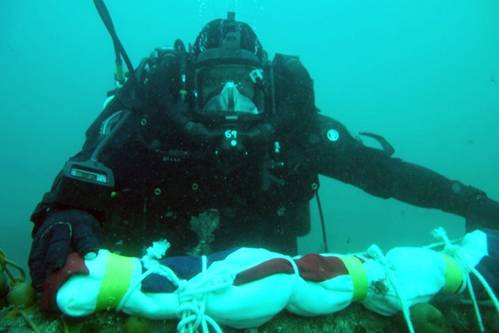 Naval divers return to the wreck of HMS Royal Oak to replace her White Ensign (Photo: UK Royal Navy)