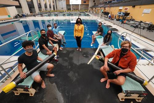 Nina Mahmoudian (center) and her students have developed an underwater glider that can operate silently and in confined spaces, ideal for conducting biology or climate studies without disturbing wildlife. (Purdue University photo/Jared Pike)