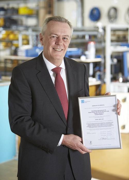 John Ramsden, Managing Director for Sonardyne, with Sonardyne Ltd.’s OHSAS 18001 certification