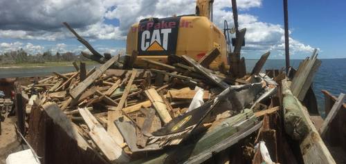 Removing dock debris left in the wake of Hurricane Florence, September 2018. (Photo: North Carolina Coastal Federation)