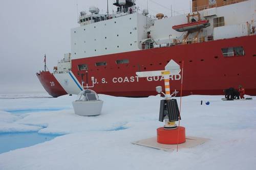 Researchers set up instruments to begin data collection on an ice floe next to USCGC Healy in the Beaufort Sea, Aug. 6, 2023. (Photo: Zane Miagany / U.S. Coast Guard)
