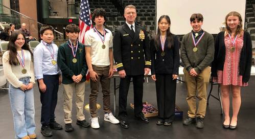 U.S. Navy Reservist Lt. Cmdr. Kevin Quinn (center) presents NUWC Innovation Awards to the winners of the R.I. State Science and Engineering Fair. Credit: U.S. Navy/Kevin Quinn