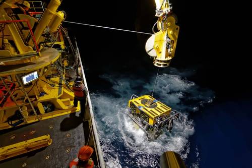 The ROPOS ROV surfaces as it comes up from a night dive.