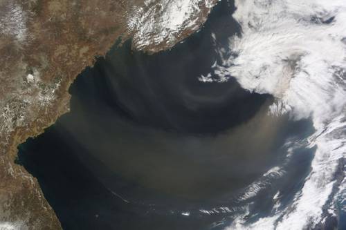 A 2012 satellite image shows a dust storm blowing over the Sea of Japan out to the North Pacific. (Image: NASA)