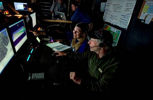 Scientists view canyon data in the NOAA Ship Okeanos Explorer control room. Image courtesy of NOAA Office of Ocean Exploration and Research. (Image: NOAA)