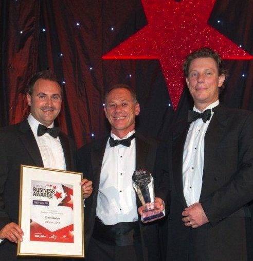 Saab Seaeye directors receive the two awards: Business of the Year and Excellence Through Innovation. Left to right, Mark Exeter, Operations Director; Matt Bates, Sales Director; Jon Robertson, Managing Director.