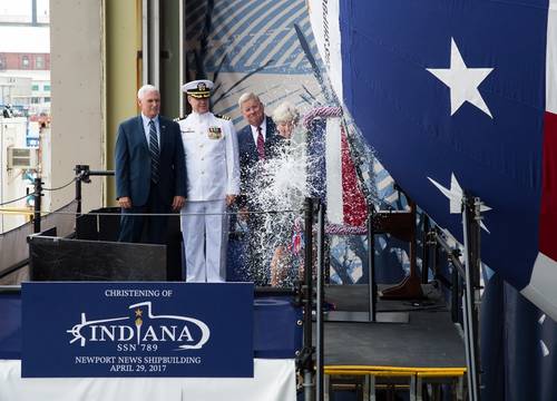 Ship's Sponsor Diane Donald christens the Virginia-class submarine Indiana (SSN 789), witnessed by (from left) Vice President Mike Pence, Indiana's  Commanding Officer, Cdr. Jesse Zimbauer and Newport News Shipbuilding President Matt Mulherin. (U.S. Navy photo courtesy Huntington Ingalls Industries by Ashley Major)