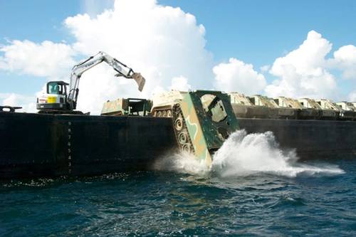 The South Carolina Army National Guard and the South Carolina Department of Natural Resources turns unused armored carrier vehicles into an artificial reef off the coast of Beaufort, S.C. in 2014. (Courtesy photo by Phillip Jones/South Carolina Army National Guard)