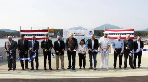 A long line of special guests, including NOAA Administrator Dr. Rick Spinrad (5th from the left), participate in a ribbon-cutting ceremony for the NOAA-renovated port facility in Ketchikan, Alaska, on August 21, 2023. (Photo: NOAA Office of Marine and Aviation Operations)