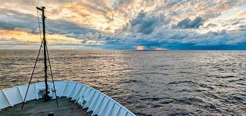 A sunrise captured from the bow of NOAA Ship Okeanos Explorer as the crew sailed through the Gulf of Alaska during the Seascape Alaska 1: Aleutians Deepwater Mapping expedition. Credit: Sam Cuellar, NOAA Ocean Exploration