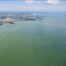 An aerial photo of the green waters of harmful algal bloom in western Lake Erie, July 20, 2020.  (Image credit: Courtesy of Zachary Haslick, Aerial Associates) 