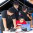 Mirolla Saleb (center) of Bishop Stang High School in North Dartmouth, Massachusetts, drives her team’s remotely operated vehicle (ROV) in a test pool as teammates Alexander Tungkasiri (from left) of The Pennington School in New Jersey, and Rhode Island students, Joseph Vitolo of East Providence High School, Cole Shotwell of North Kingstown High School, and Avi Tripurneni of East Greenwich High School, look on. The ROV competition, held on Aug. 13, 2025, was part of the Naval Undersea Warfare Ce