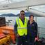 Pictured from left to right: Adrian Maharaj (Pioneer Consulting's shipboard representative) and Sarah Kathrein (CTC Project Manager) aboard the marine route survey vessel for the FISH West and FISH South submarine cable systems at the start of the survey in May 2025. © Cordova Telecom Cooperative, Inc.