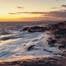 Waves wash against Nova Scotia's Atlantic coast at Peggy's Cove Lighthouse. © Carbon to Sea