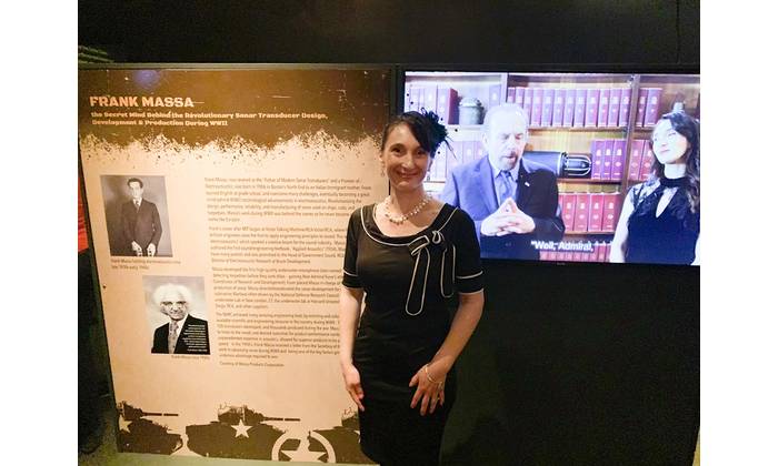Dawn Massa Stancavish standing in front of a display at the Reagan National Library’s “Secrets of WWII” exhibit honoring her grandfather, Frank Massa. Photo courtesy Massa
