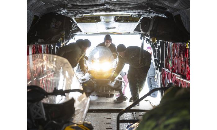 Members of 1 Canadian Ranger Patrol Group and Sergeant Andrew Deutsch of the CH-147F Chinook crew loading a snowmobile to prior to takeoff to the Ski Landing Area (SLA) camp as part of Operation NANOOK-NUNALIVUT in Inuvik NWT. 
Credit: Corporal Jacob Hanlon, Canadian Forces Photo
