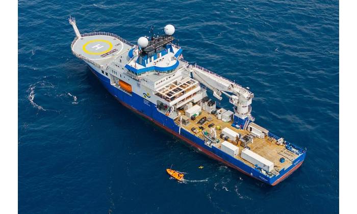 The science team recovers a glider after weeks of collecting data. During the expedition, two gliders provided continuous physical and biological data, including temperature, currents, dissolved oxygen, microstructure turbulence, and zooplankton presence. This process helped scientists select data-collection stations in near-real time. © Alex Ingle / Schmidt Ocean Institute