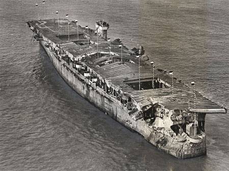 Aerial view of ex-USS Independence at anchor in San Francisco Bay, California, January 1951. There is visible damage from the atomic bomb tests at Bikini Atoll. (Credit: San Francisco Maritime National Historical Park, P82-019a.3090pl_SAFR 19106)