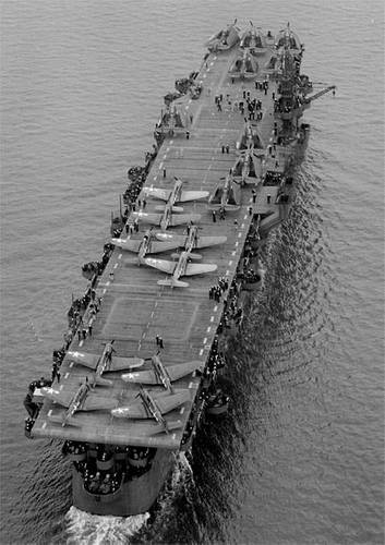 Aerial view of USS Independence (CVL 22) underway July 15, 1943 in San Francisco Bay, California. Before departing San Francisco, USS Independence’s hull classification changed from CV 22 “aircraft carrier” to CVL 22, “light aircraft carrier.” (Credit: U.S. Navy, National Archives, 80-74436)