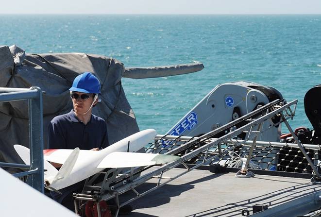 Andrew Lock, of Southampton University, prepares the vehicle for launch. (U.K Navy photo)