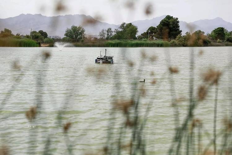 An autonomous boat made by researchers at The
University of Texas at El Paso floats at Ascarate Lake, located in El Paso, Texas. Credit: The University of
Texas at El Paso.
