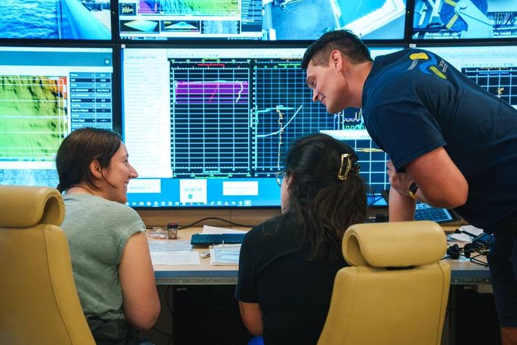 Beate Kraft (Principal Investigator, University of Southern Denmark) and Sibille Améstica (Student, Pontificia Universidad Católica de Chile) monitor conductivity, temperature, and depth (CTD) data in the Computer Electronics Lab on Research Vessel Falkor (too) next to Josh O’Brien (Marine Technician).
Credit: Alex Ingle / Schmidt Ocean Institute
