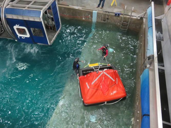 A life raft is brought near to the cabin to pick up survivors/escapees. (Photo: Tom Mulligan)