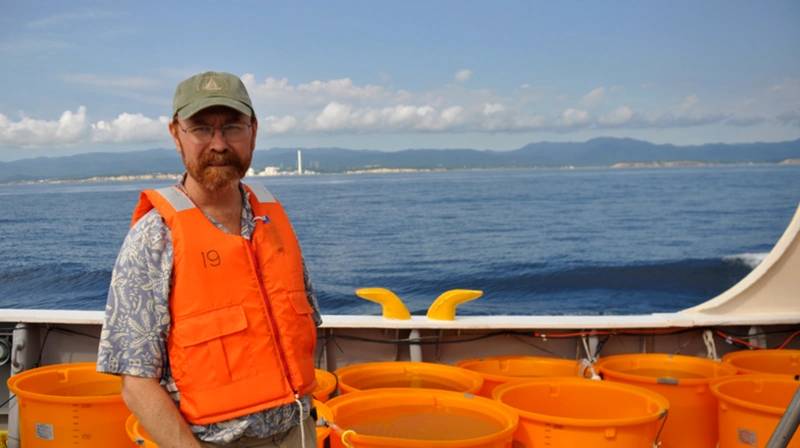 Ken Buesseler stands on the deck of a research vessel while working off the coast of Japan. (Photo courtesy of Woods Hole Oceanographic Institution)