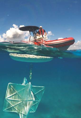 CARTHE drifter deployment from a small boat offshore Miami. (Photo: GreenWave Instruments LLC)