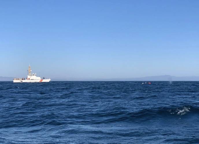 Coast Guard Cutter Hawksbill assists NOAA personnel with the disentanglement of a whale three miles southwest of Santa Cruz. (U.S. Coast Guard photo)
