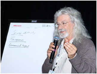 Co-convener of the Town Hall on Marine Debris, René Garello, discussing some results.  (Photo courtesy of Rick A. Smith) 