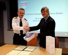 Commodore Guy Robinson from Navy Command Headquarters shaking hands with Geraint West, the NOC’s Director of National Marine Facilities after the signing of the Memorandum of Understanding
