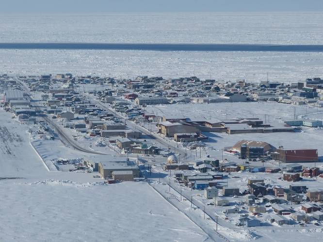 The community of Utqiagvik, Alaska, sits on Alaska’s Arctic Ocean coast. A narrow lead of open water is at the edge of the shore-fast sea ice. Photo by Andy Mahoney, UAF Geophysical Institute