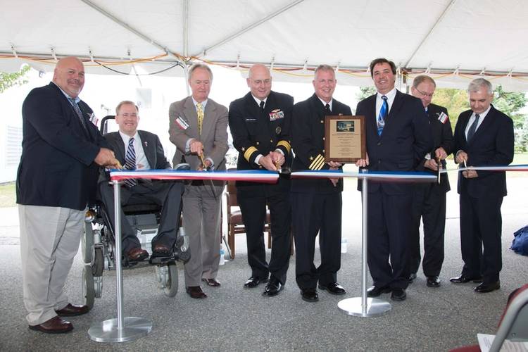 Cutting the ribbon, from left, Dominic Galluci, P&S Construction; RI Congressman James Langevin; RI Governor Lincoln Chafee; Rear Adm. Michael Jabaley, commander, NUWC; Capt. Todd Cramer, commander, NUWC Division Newport; Mark Rodrigues, head NUWC's Platform and Payload Integration Department; Blair Decker, General Dynamics/Electric Boat; and RI Senator Jack Reed.