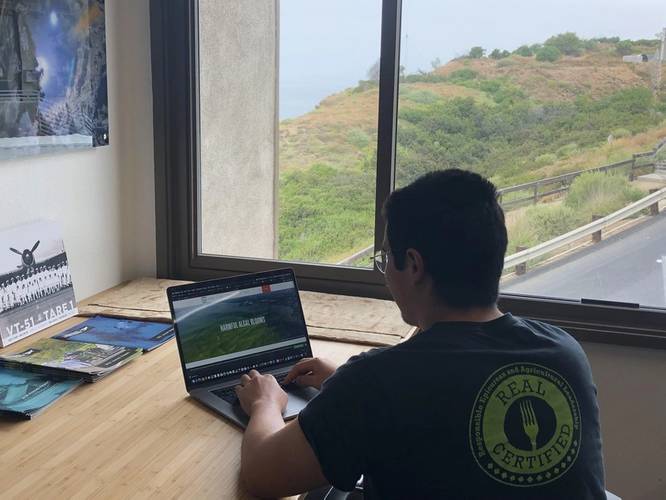 UC San Diego mechanical engineering major Raymond Young works on a team project, sponsored by Boeing, for the class Hacking for the Oceans. His team is developing a software suite of autonomous unmanned surface vehicle behaviors that could help scientists monitor the environment for harmful algal blooms. Image Courtesy UC San Diego