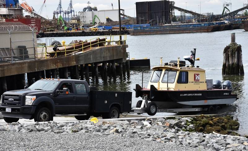 A District vehicle retrieves a survey vessel at the New York District's reconstructed Caven Point Marine Terminal in Jersey City, N.J., June 12, 2018. The new boat ramp enables launching and retrieving craft during all points in the tide cycle. A section of the Hydrogaphic Surveys class was taught aboard survey vessels on the water in New York-New Jersey Harbor. (Photo by James D'Ambrosio)