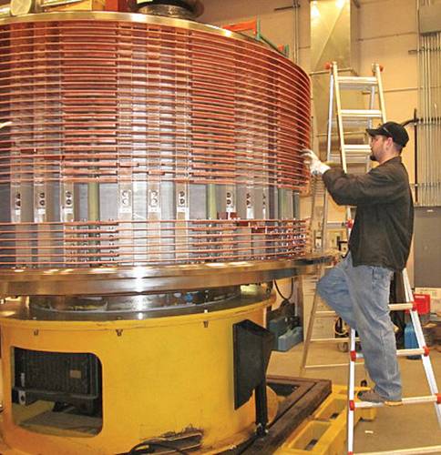 An employee works on the production of a large electrical slip ring at Moog Focal’s Nova Scotia facility.