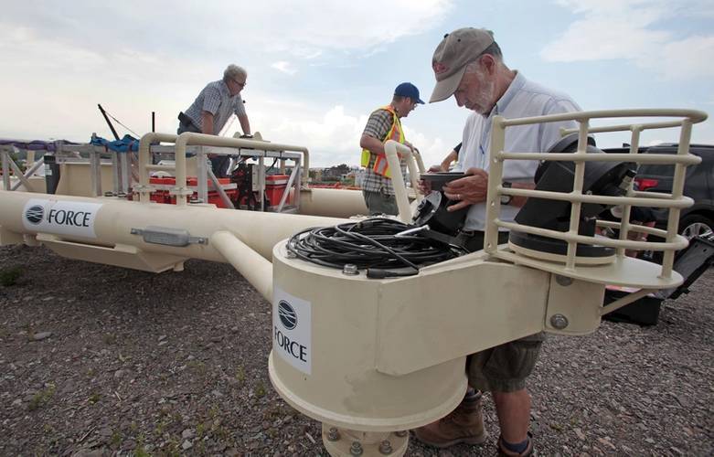 Alex Hay examines acoustic sensor on FAST-1 (Image: Darren Pitmann/ImagesEast)