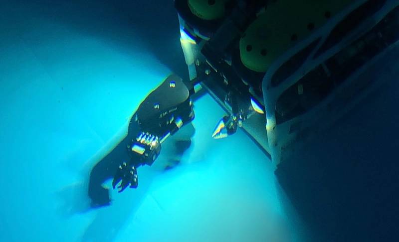Falcon fitted with multi-function manipulator in test tank. 
(Photo by Collin Dobson, Woods Hole Oceanographic Institution)
 