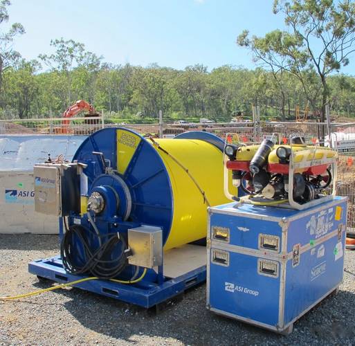Falcon with 5km umbilical winch and shipping containers on site Gladstone Bay, Australia.