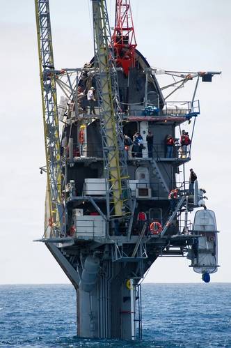Fifty-five feet remain visible after the crew of the Floating Instrument Platform, or FLIP, partially flood the ballast tanks causing the vessel to turn stern first into the ocean. The 355-foot research vessel, owned by the Office of Naval Research and operated by the Marine Physical Laboratory at Scripps Institution of Oceanography at University of California, conducts investigations in a number of fields, including acoustics, oceanography, meteorology and marine mammal observation. (U.S. Navy 